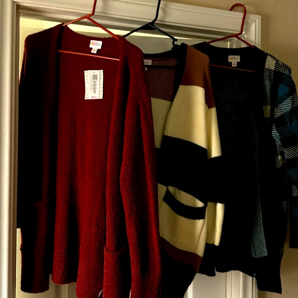 3 sweaters. Burgundy with tags, all excellent condition